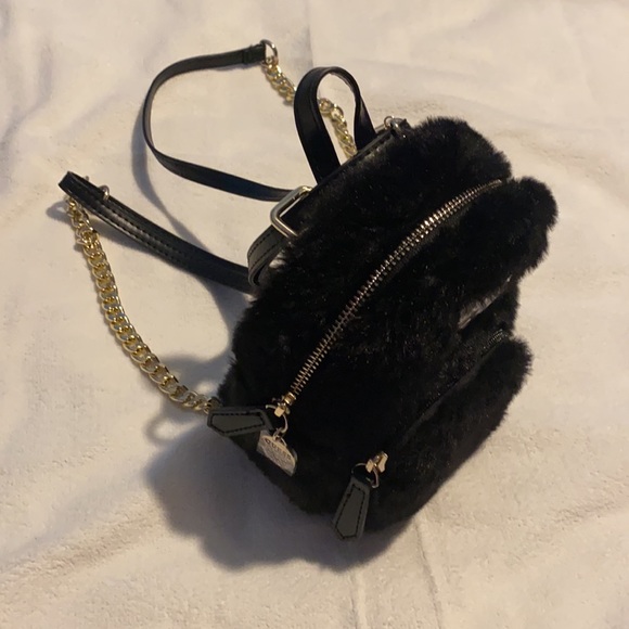 Guess Handbags - Cute Black Furry crossbody bag by Guess… can wear as a backpack too. BrandNew
